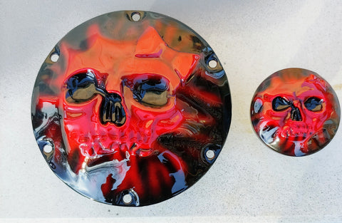 Skull and bow pushing through on Harley Davidson derby cover and fuel cap